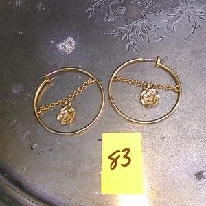 gold hoop earrings with a rose in center